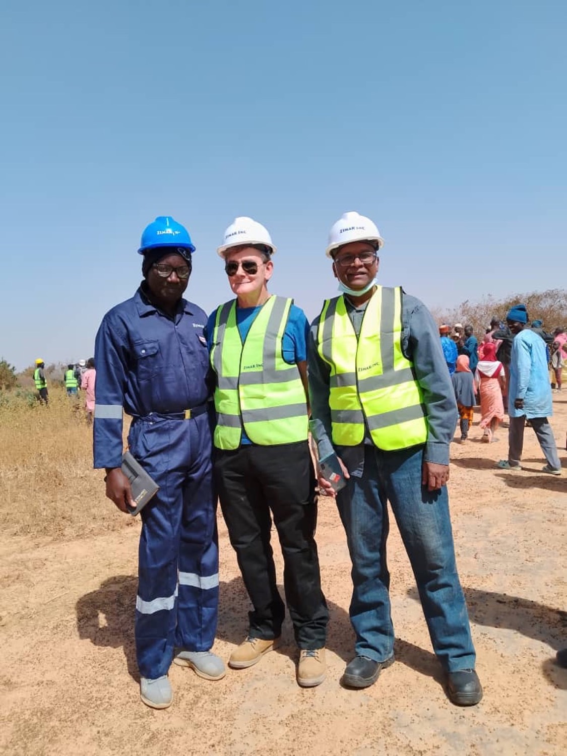 Three project team members standing on the site